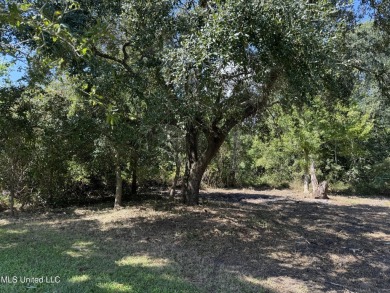 This fantastic lot features numerous adolescent oak trees on The Bridges Golf Club At Hollywood Casino in Mississippi - for sale on GolfHomes.com, golf home, golf lot