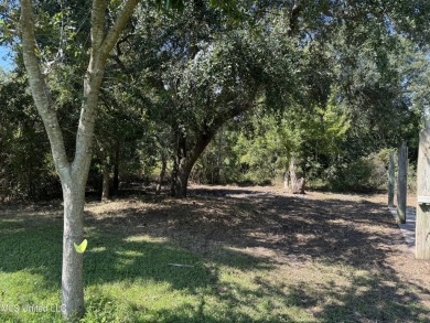 This fantastic lot features numerous adolescent oak trees on The Bridges Golf Club At Hollywood Casino in Mississippi - for sale on GolfHomes.com, golf home, golf lot