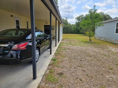 Spanish Village is an affordable housing choice for active on Plantation Golf Club in Florida - for sale on GolfHomes.com, golf home, golf lot