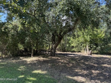 This fantastic lot features numerous adolescent oak trees on The Bridges Golf Club At Hollywood Casino in Mississippi - for sale on GolfHomes.com, golf home, golf lot