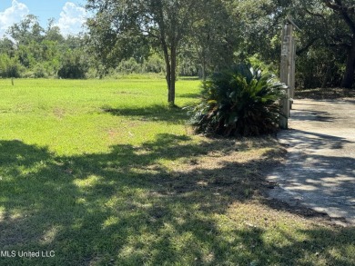 This fantastic lot features numerous adolescent oak trees on The Bridges Golf Club At Hollywood Casino in Mississippi - for sale on GolfHomes.com, golf home, golf lot