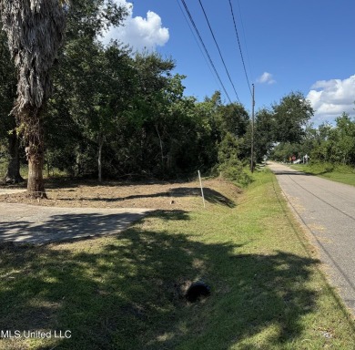 This fantastic lot features numerous adolescent oak trees on The Bridges Golf Club At Hollywood Casino in Mississippi - for sale on GolfHomes.com, golf home, golf lot