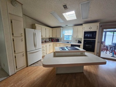 Spanish Village is an affordable housing choice for active on Plantation Golf Club in Florida - for sale on GolfHomes.com, golf home, golf lot
