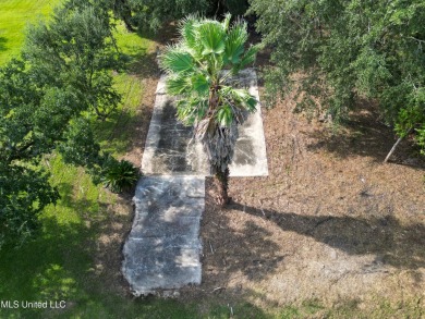 This fantastic lot features numerous adolescent oak trees on The Bridges Golf Club At Hollywood Casino in Mississippi - for sale on GolfHomes.com, golf home, golf lot