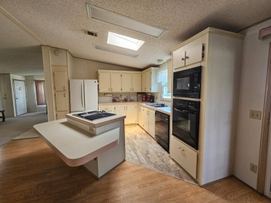 Spanish Village is an affordable housing choice for active on Plantation Golf Club in Florida - for sale on GolfHomes.com, golf home, golf lot