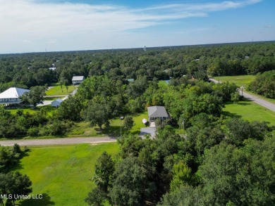 This fantastic lot features numerous adolescent oak trees on The Bridges Golf Club At Hollywood Casino in Mississippi - for sale on GolfHomes.com, golf home, golf lot