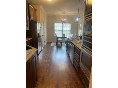 *Situated on the prestigious Hole 1 of Chamberlyne Golf Course on Chamberlyne Country Club in Arkansas - for sale on GolfHomes.com, golf home, golf lot