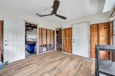 Property is located in a golf cartable neighborhood across the on The Dunedin Country Club in Florida - for sale on GolfHomes.com, golf home, golf lot