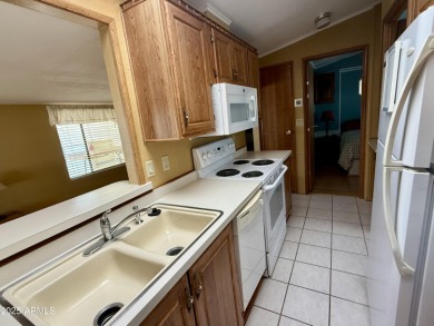 Rare chance to own both the home and land in one of the Valley's on Pueblo Golf Course in Arizona - for sale on GolfHomes.com, golf home, golf lot