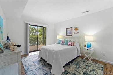 This beautiful 2-bedroom, 2-bath furnished end unit condominium on Seasons Ridge At Four Seasons in Missouri - for sale on GolfHomes.com, golf home, golf lot