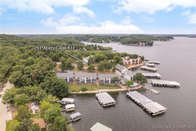 This beautiful 2-bedroom, 2-bath furnished end unit condominium on Seasons Ridge At Four Seasons in Missouri - for sale on GolfHomes.com, golf home, golf lot