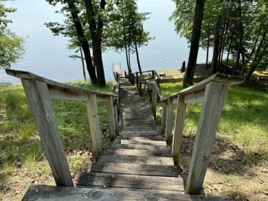 This beautiful Lake Mecosta property features 137 feet of nice on St. Ives Golf Club in Michigan - for sale on GolfHomes.com, golf home, golf lot