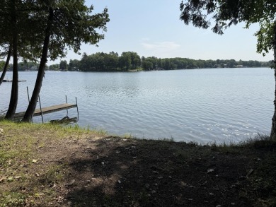 This beautiful Lake Mecosta property features 137 feet of nice on St. Ives Golf Club in Michigan - for sale on GolfHomes.com, golf home, golf lot