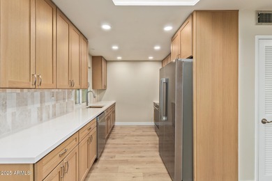 This stunning Sun City residence has been fully remodeled and is on Sun City Lakes West and East in Arizona - for sale on GolfHomes.com, golf home, golf lot