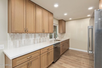 This stunning Sun City residence has been fully remodeled and is on Sun City Lakes West and East in Arizona - for sale on GolfHomes.com, golf home, golf lot