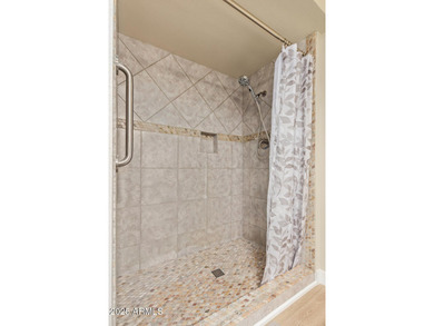 This stunning Sun City residence has been fully remodeled and is on Sun City Lakes West and East in Arizona - for sale on GolfHomes.com, golf home, golf lot