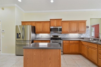 If you are looking for a spacious, well-maintained pool home in on Links At Greenfield Plantation in Florida - for sale on GolfHomes.com, golf home, golf lot