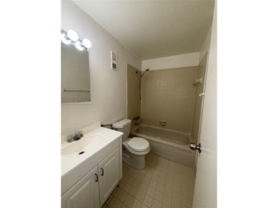 Discover this charming townhouse with 3 spacious bedrooms and 3 on Pine Island Ridge Country Club in Florida - for sale on GolfHomes.com, golf home, golf lot