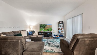 Discover this charming townhouse with 3 spacious bedrooms and 3 on Pine Island Ridge Country Club in Florida - for sale on GolfHomes.com, golf home, golf lot