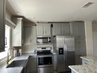 TWO YEAR OLD CONSTRUCTION! TAKE A LOOK AT THIS 2022 MODEL WITH on The Links of Lake Bernadette in Florida - for sale on GolfHomes.com, golf home, golf lot