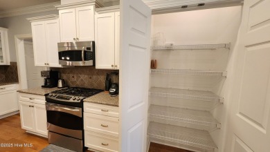Step into this elegant 2900+ square foot home that combines on Brunswick Plantation and Golf Resorts in North Carolina - for sale on GolfHomes.com, golf home, golf lot