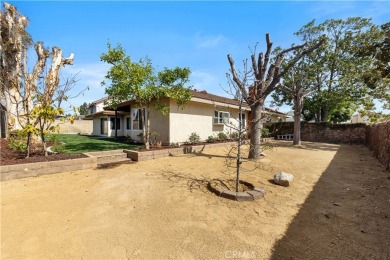 Attractive single story on a corner lot is ready for you! This on Alta Vista Country Club in California - for sale on GolfHomes.com, golf home, golf lot