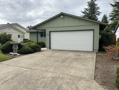 This home features an open floor plan with a view of two golf on Senior Estates Golf and Country Club in Oregon - for sale on GolfHomes.com, golf home, golf lot