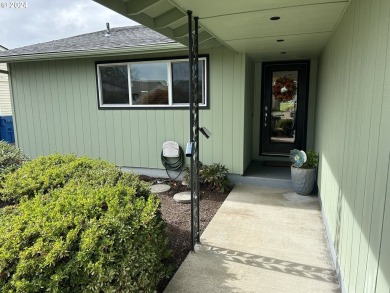 This home features an open floor plan with a view of two golf on Senior Estates Golf and Country Club in Oregon - for sale on GolfHomes.com, golf home, golf lot