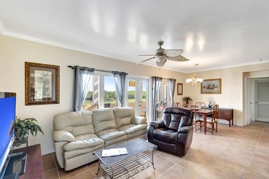 Discover this pristine furnished 2-bedroom, 2-bathroom steps on Oak Harbor Country Club in Florida - for sale on GolfHomes.com, golf home, golf lot