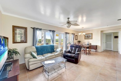 Discover this pristine furnished 2-bedroom, 2-bathroom steps on Oak Harbor Country Club in Florida - for sale on GolfHomes.com, golf home, golf lot