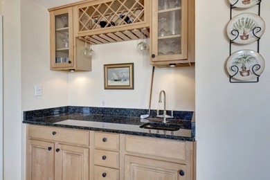 Discover this pristine furnished 2-bedroom, 2-bathroom steps on Oak Harbor Country Club in Florida - for sale on GolfHomes.com, golf home, golf lot