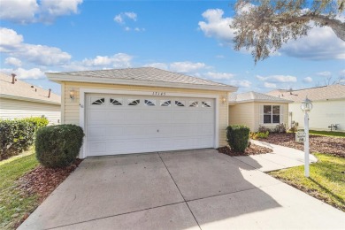 Welcome to this beautifully updated Banyan/Bougainvillea model on The Links of Spruce Creek in Florida - for sale on GolfHomes.com, golf home, golf lot