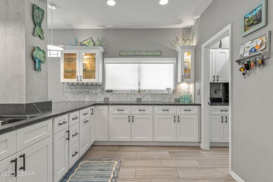 Stylish & Contemporary.  Located in Spruce Creek Fly-In's on Spruce Creek Golf Club in Florida - for sale on GolfHomes.com, golf home, golf lot