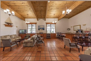 This stunning CBS home sits on a prime lot, offering serene on Spanish Lakes Fairways in Florida - for sale on GolfHomes.com, golf home, golf lot