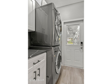 Stylish & Contemporary.  Located in Spruce Creek Fly-In's on Spruce Creek Golf Club in Florida - for sale on GolfHomes.com, golf home, golf lot