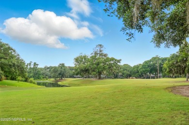 If you enjoy socializing and entertaining, this five-bedroom on Queens Harbour Yacht and Country Club in Florida - for sale on GolfHomes.com, golf home, golf lot