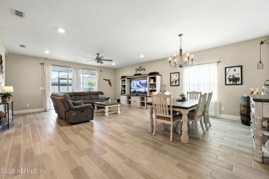 This immaculate home built in 2021 is MOVE IN READY and offers on Golf Club At South Hampton in Florida - for sale on GolfHomes.com, golf home, golf lot