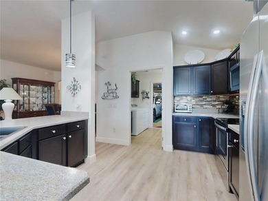 This LOVELY 3/2 IRIS Designer sits on an OVERSIZED lot with on Pennbrooke Fairways in Florida - for sale on GolfHomes.com, golf home, golf lot