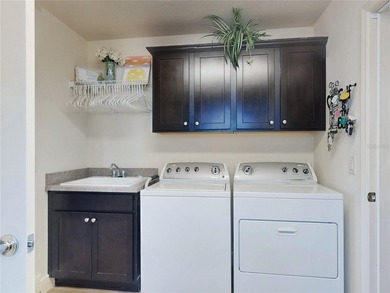 This LOVELY 3/2 IRIS Designer sits on an OVERSIZED lot with on Pennbrooke Fairways in Florida - for sale on GolfHomes.com, golf home, golf lot