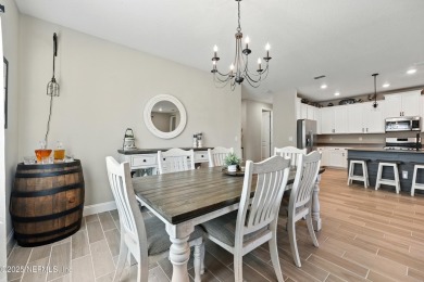 This immaculate home built in 2021 is MOVE IN READY and offers on Golf Club At South Hampton in Florida - for sale on GolfHomes.com, golf home, golf lot