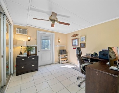 This well-maintained and tastefully updated 2-bedroom on Highland Lakes Executive Golf Course in Florida - for sale on GolfHomes.com, golf home, golf lot