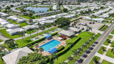 Spacious 2BR/2BA on Large Corner Lot in Leisureville! Bright and on Leisureville Community Golf Course in Florida - for sale on GolfHomes.com, golf home, golf lot
