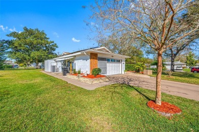 This well-maintained and tastefully updated 2-bedroom on Highland Lakes Executive Golf Course in Florida - for sale on GolfHomes.com, golf home, golf lot