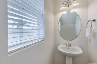 The spacious primary bedroom is on the main level. This is on Hoakalei Country Club At Ocean Pointe in Hawaii - for sale on GolfHomes.com, golf home, golf lot