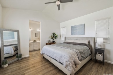 The spacious primary bedroom is on the main level. This is on Hoakalei Country Club At Ocean Pointe in Hawaii - for sale on GolfHomes.com, golf home, golf lot