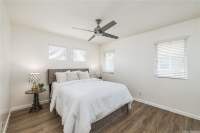 The spacious primary bedroom is on the main level. This is on Hoakalei Country Club At Ocean Pointe in Hawaii - for sale on GolfHomes.com, golf home, golf lot