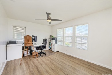 The spacious primary bedroom is on the main level. This is on Hoakalei Country Club At Ocean Pointe in Hawaii - for sale on GolfHomes.com, golf home, golf lot