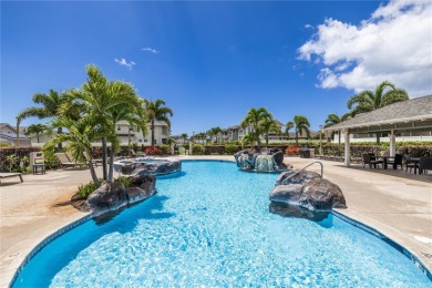 The spacious primary bedroom is on the main level. This is on Hoakalei Country Club At Ocean Pointe in Hawaii - for sale on GolfHomes.com, golf home, golf lot