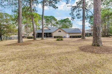 Discover the allure of this stunning single-story custom home on Tiger Point Golf and Country Club in Florida - for sale on GolfHomes.com, golf home, golf lot