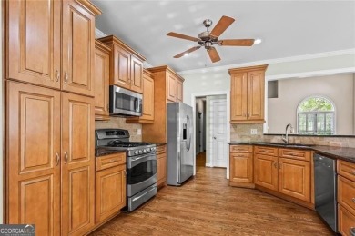 Easy Living in The Spinnakers of Windward! Downsize without on The Golf Club of Georgia in Georgia - for sale on GolfHomes.com, golf home, golf lot